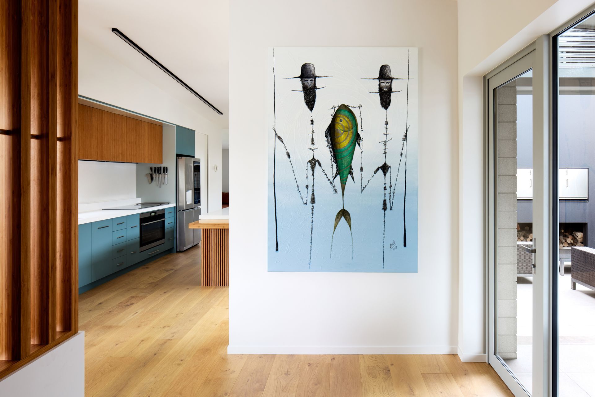 The homeowners are art collectors. “The painting on the wall at the front entrance was picked up from a street artist in Mexico. It’s a favourite piece and an important part of the house,” says Nick.