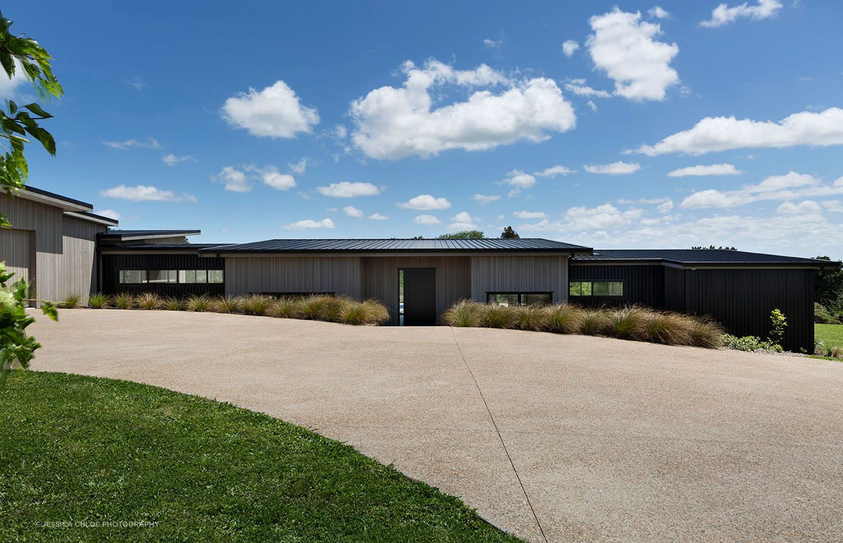 Nestled into the landscape following the lines of the property