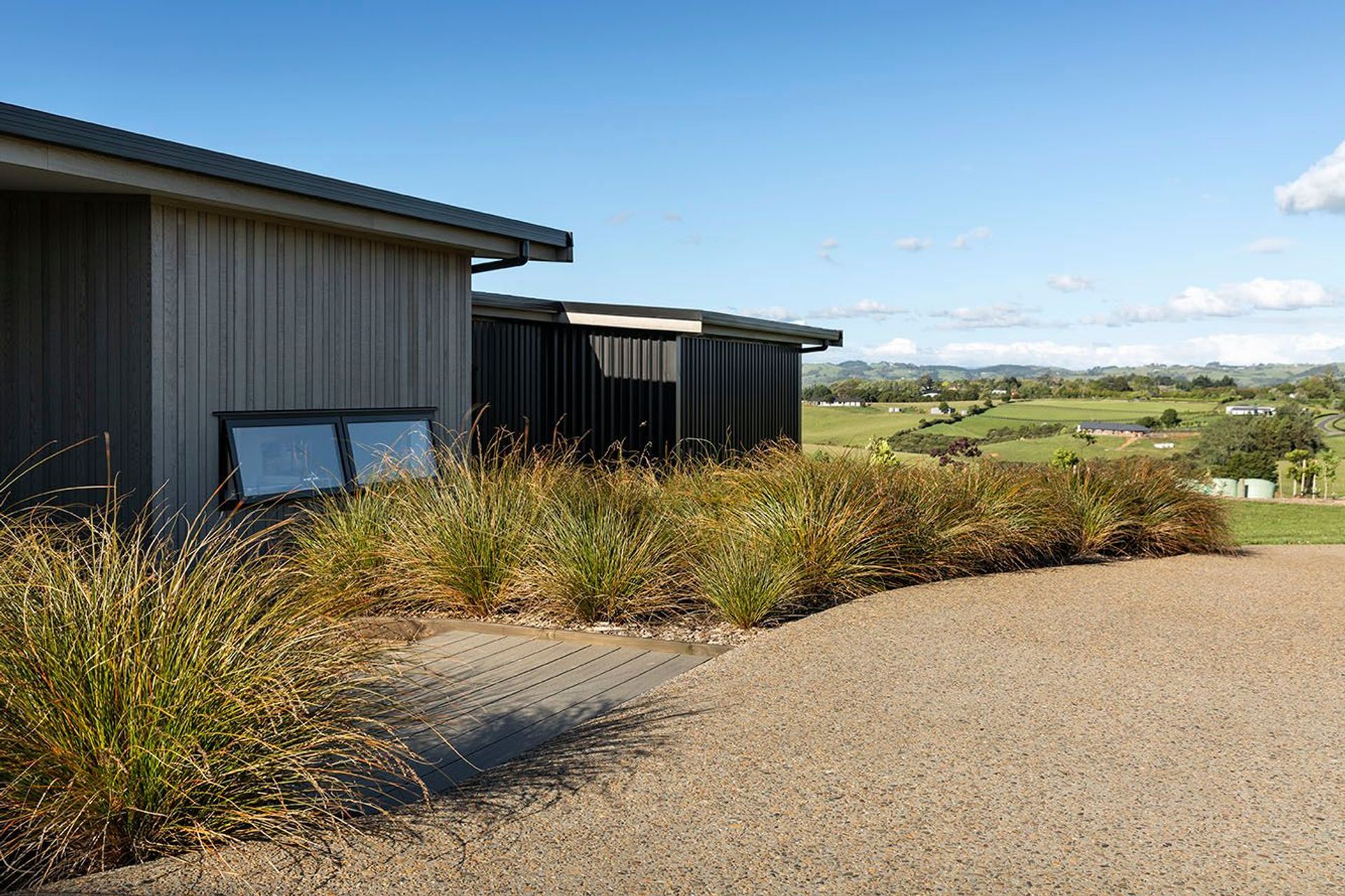 Cladding variations share vertical lines and rest well within the landscape
