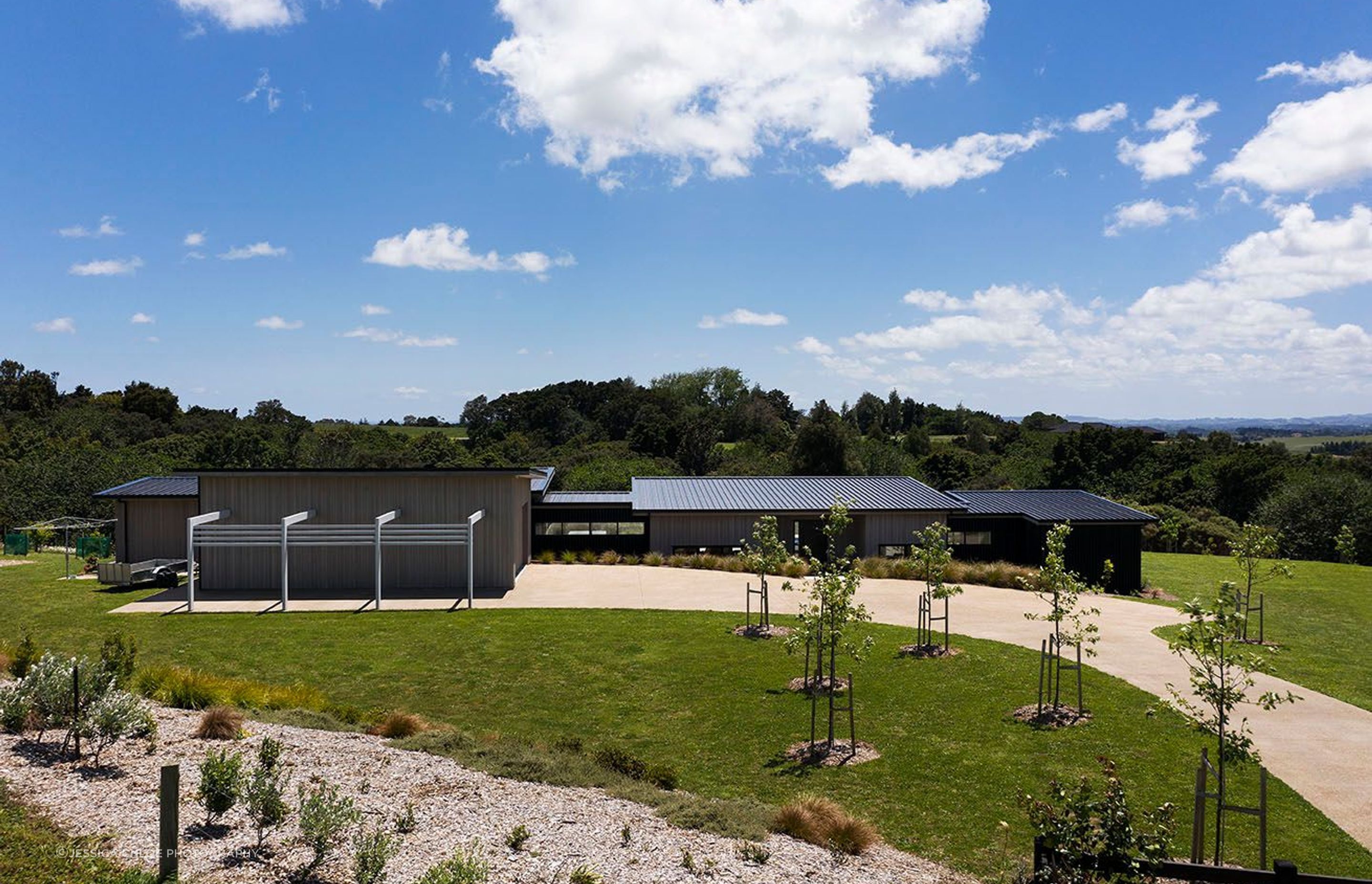 Clean addition to the landscape as this home sprawls across it's living spaces