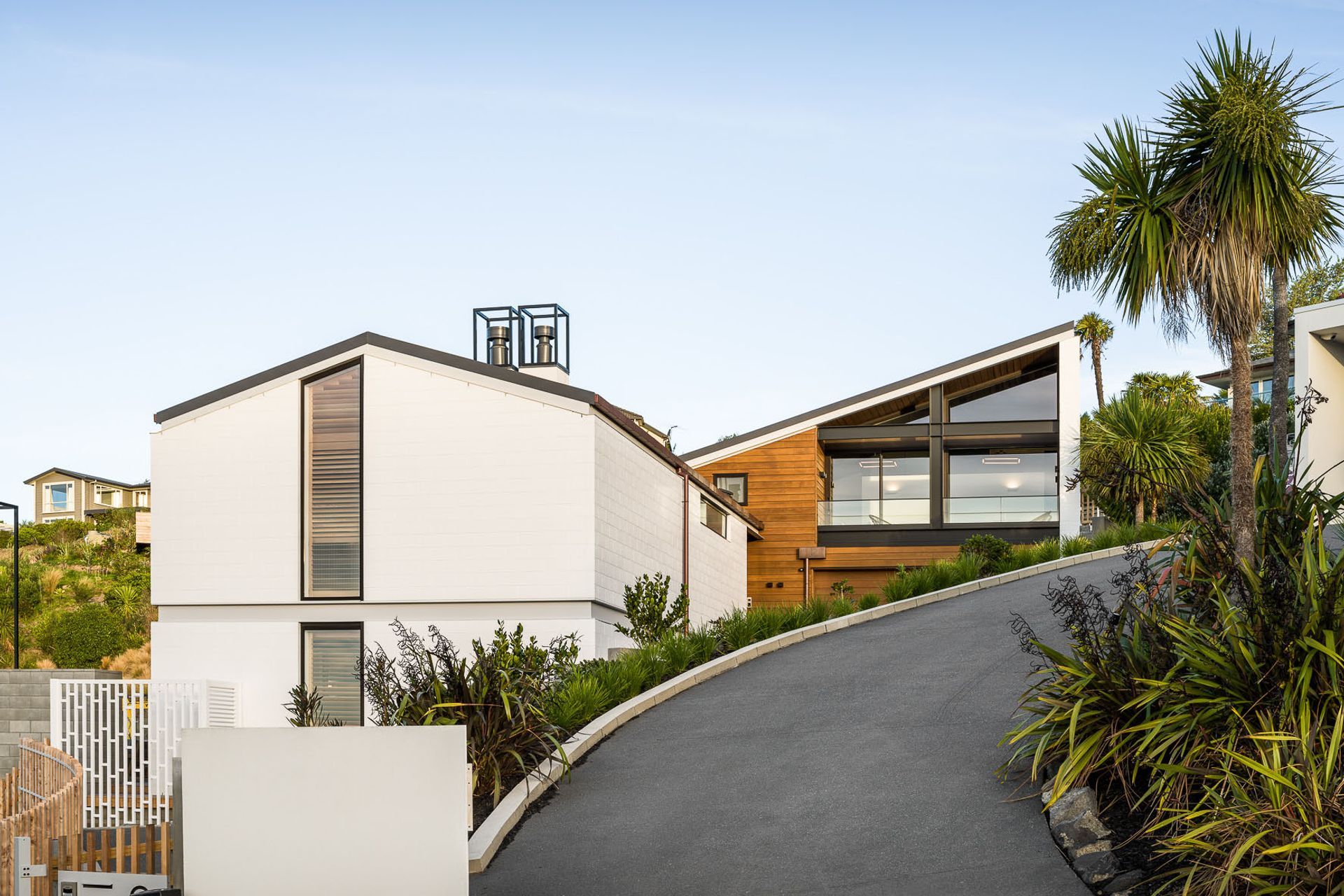 The house has been arranged over three split levels with a further portion built over the garage and clad in timber weather boards.