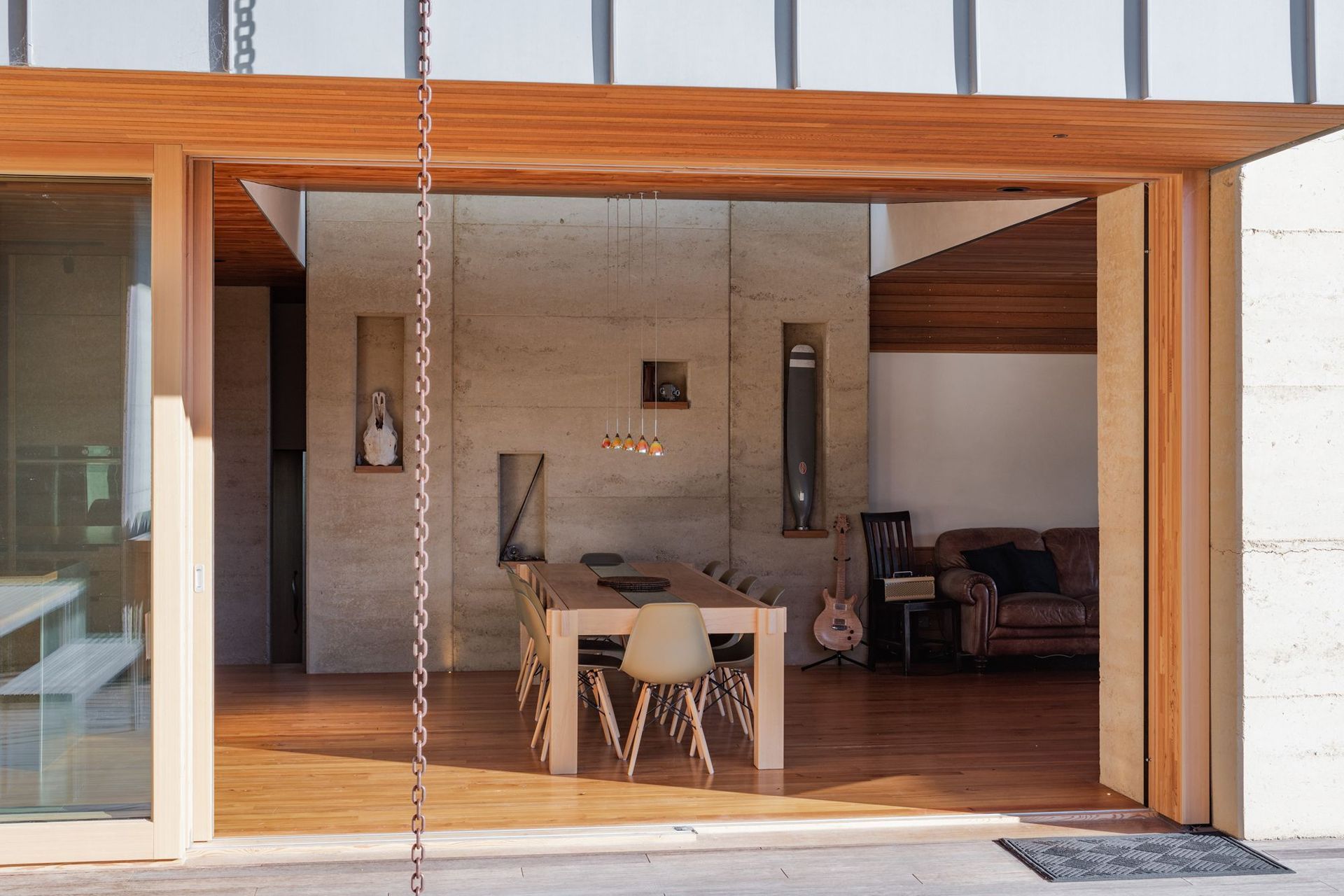 The materials were chosen for their various contributions to sustainability—whether its the thermal mass provided by the rammed earth or low-maintenance nature of the timbers and even the high-performance ratings of the glazing and insulation.