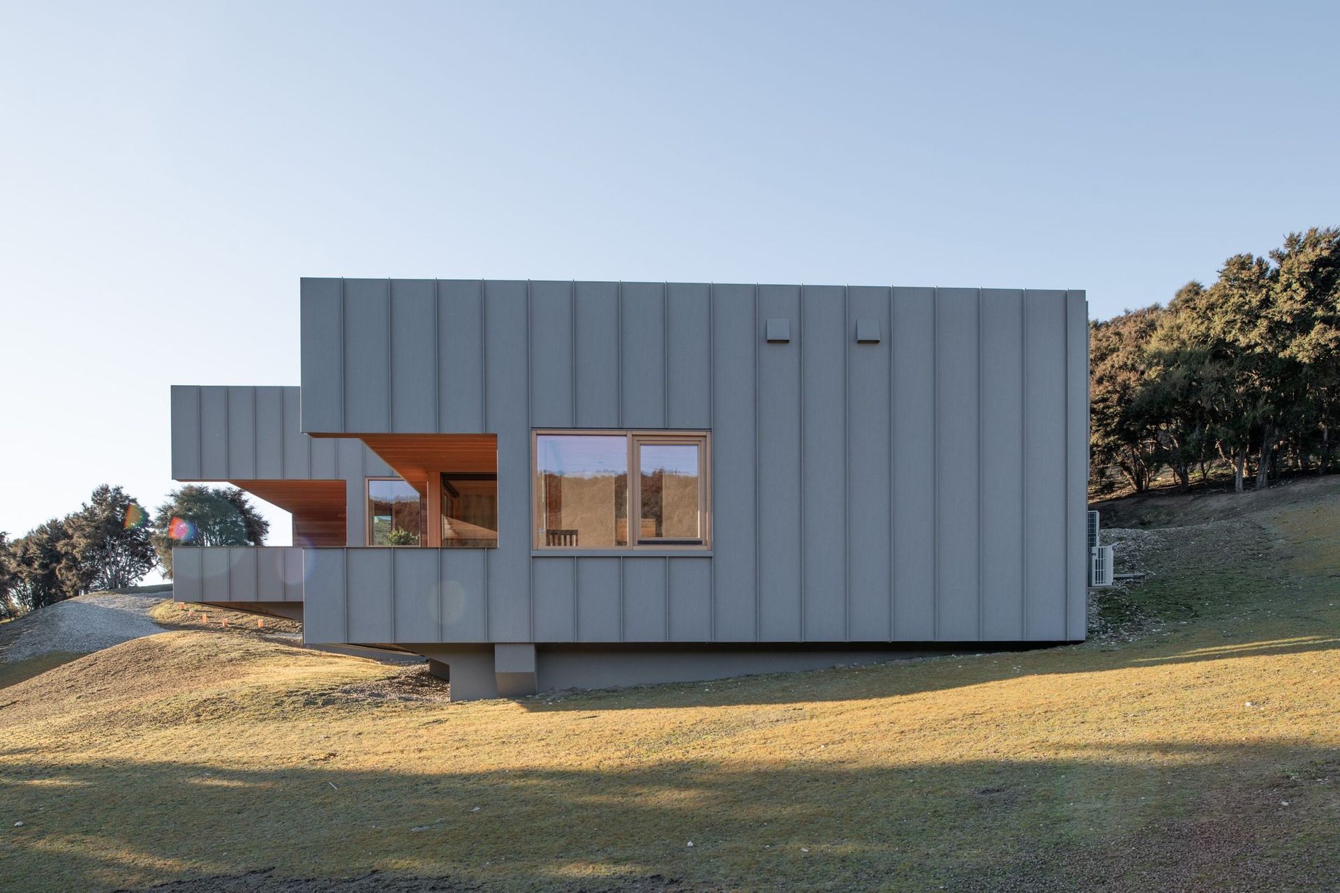 The zinc-coated aluminium will continue to patina over the time further softening the mass of the home as seen from the southern boundary.