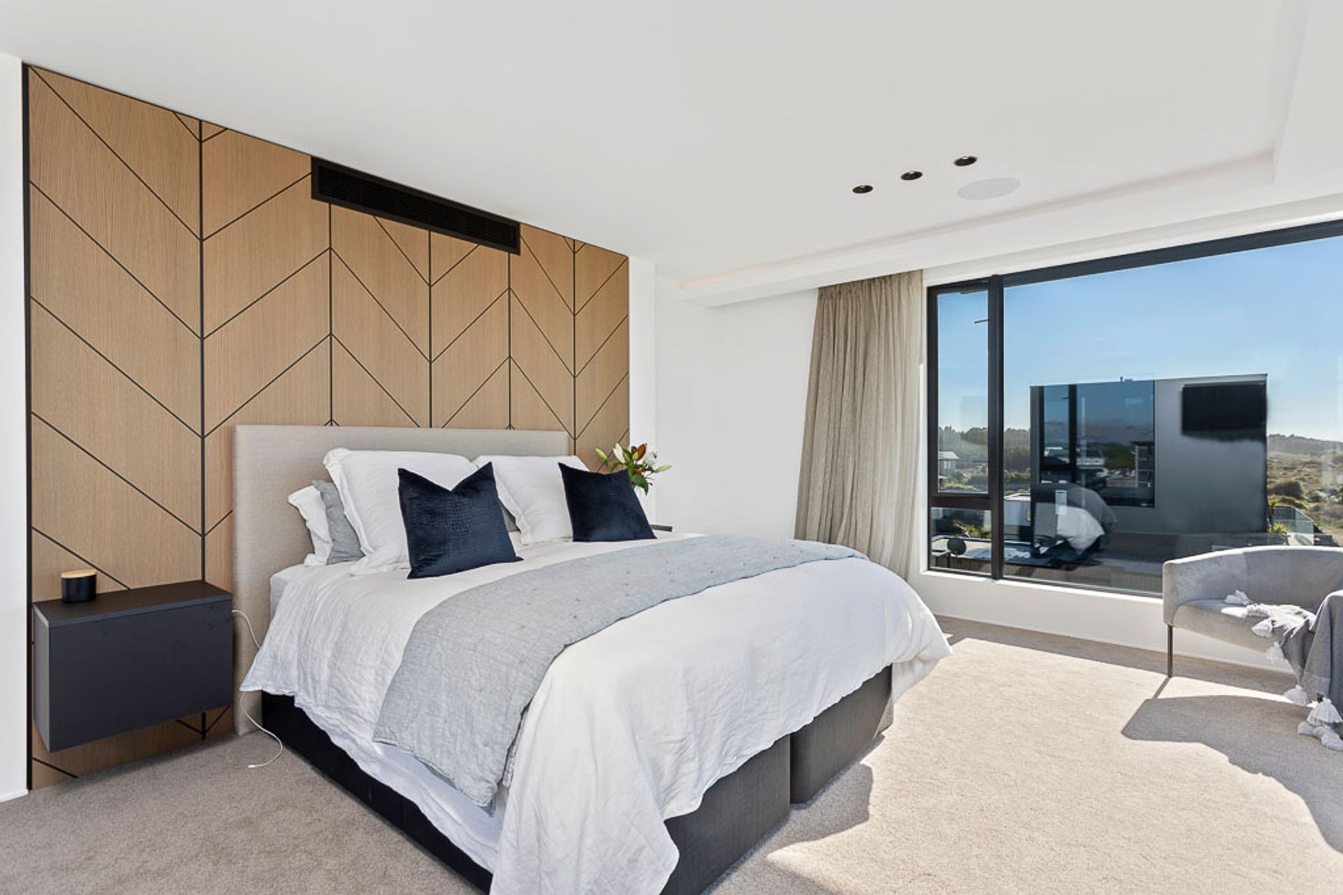 The master features a built-in headboard feature.