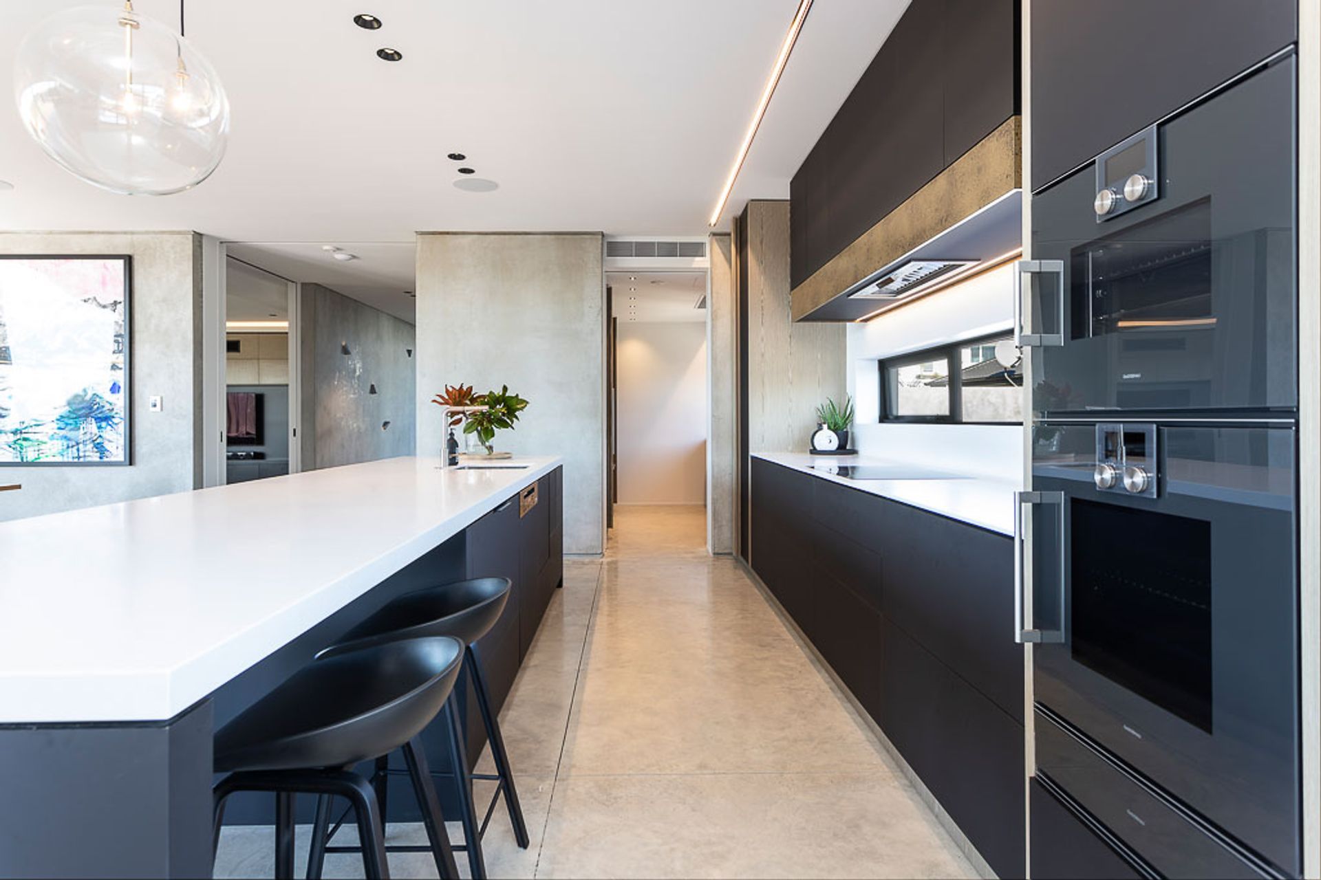 A scullery at the rear of the kitchen provides a space to hide kitchen clutter.