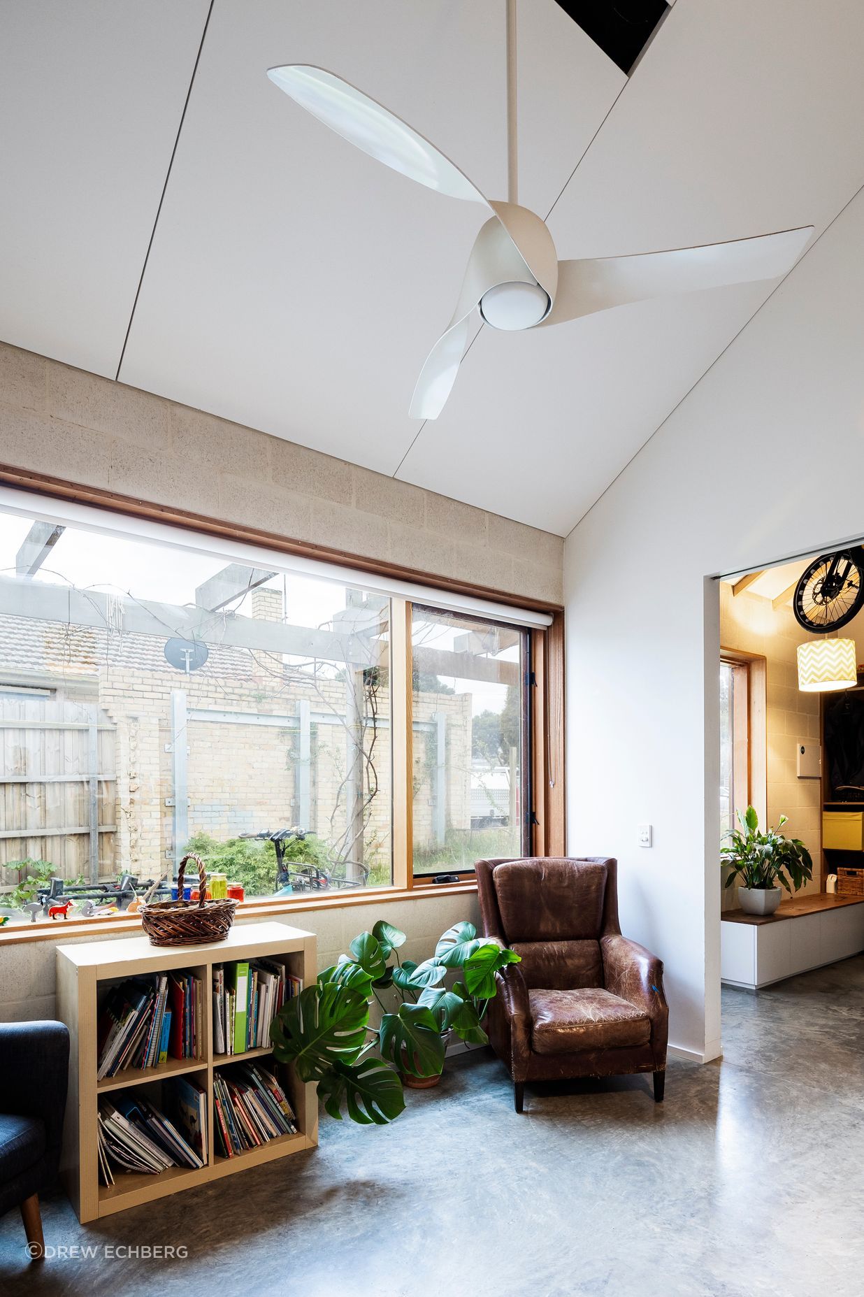 A sun-filled living room with lots of exposed internal thermal mass for heat storage