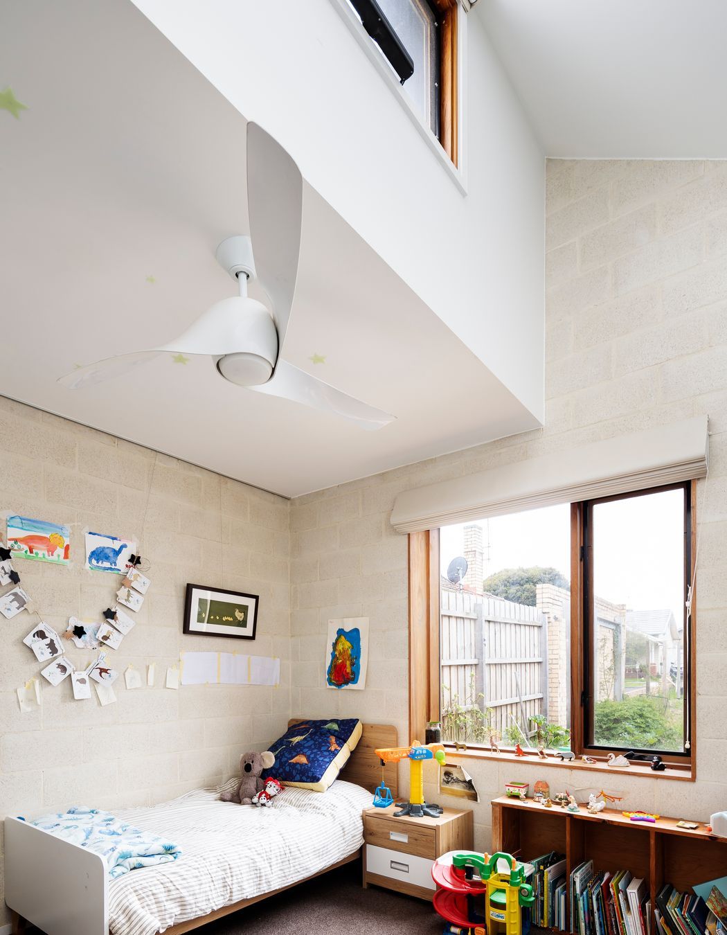 High level windows and ceiling sweep fans for good ventilation and passive solar