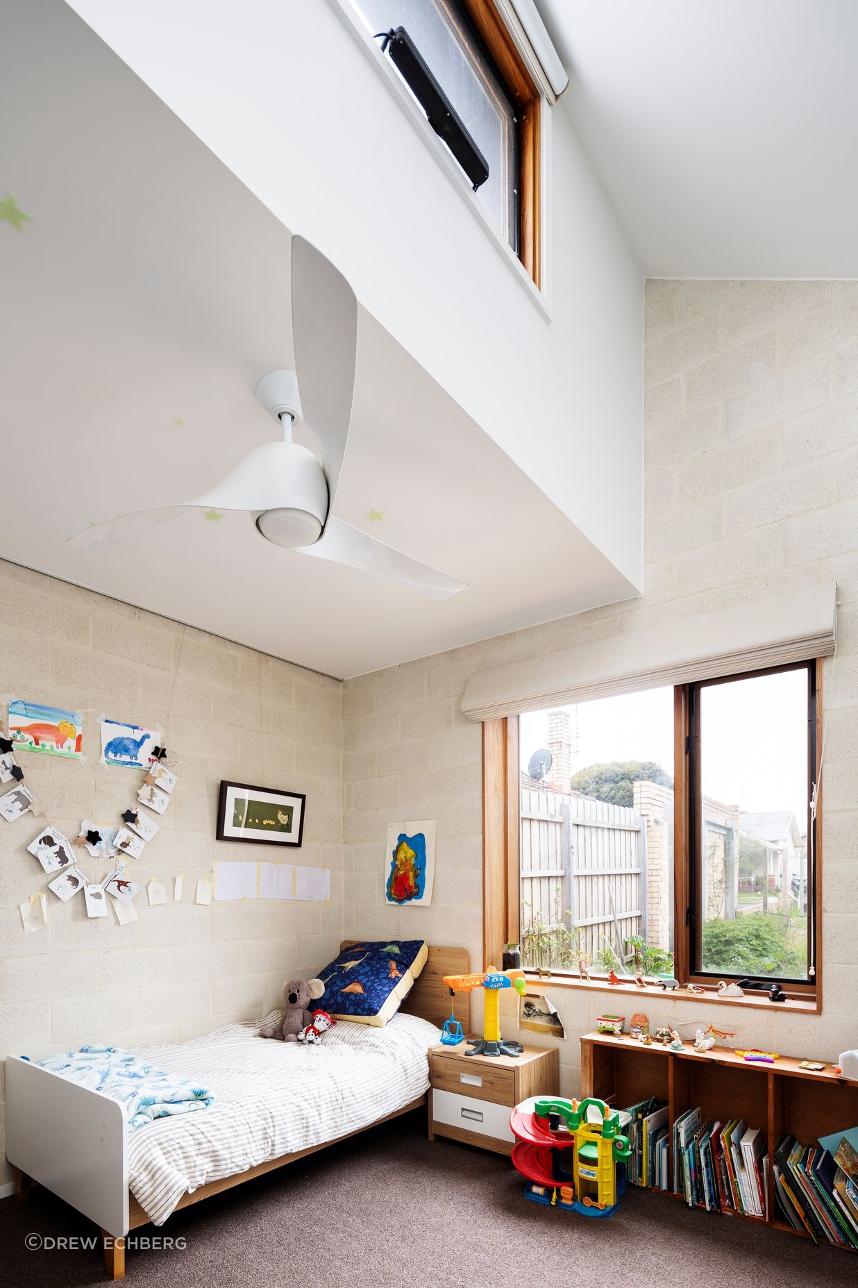 High level windows and ceiling sweep fans for good ventilation and passive solar