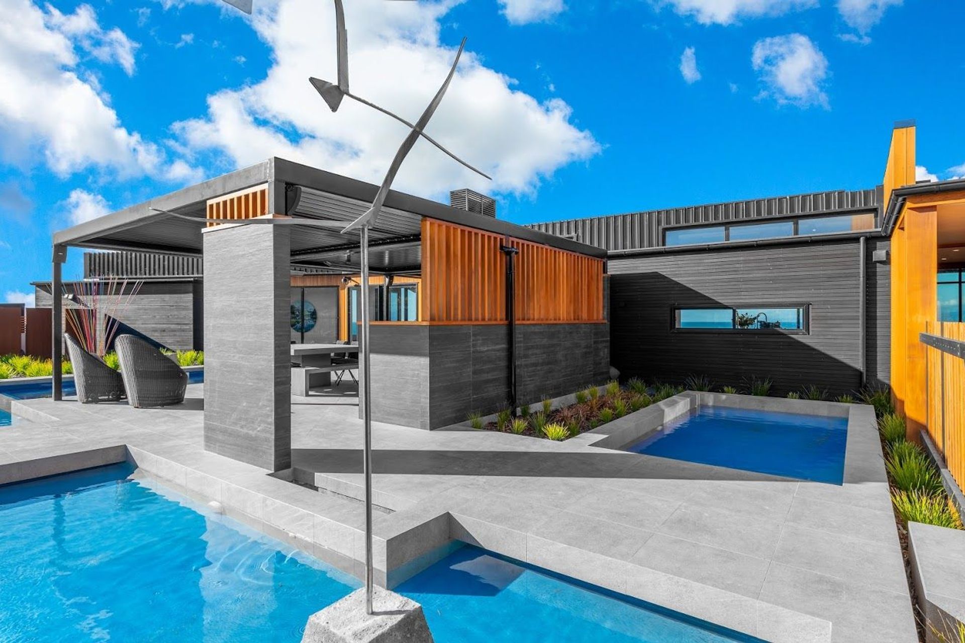 As you walk in along the boardwalk to the right, visitors can enjoy an elegant water feature in the pool area.