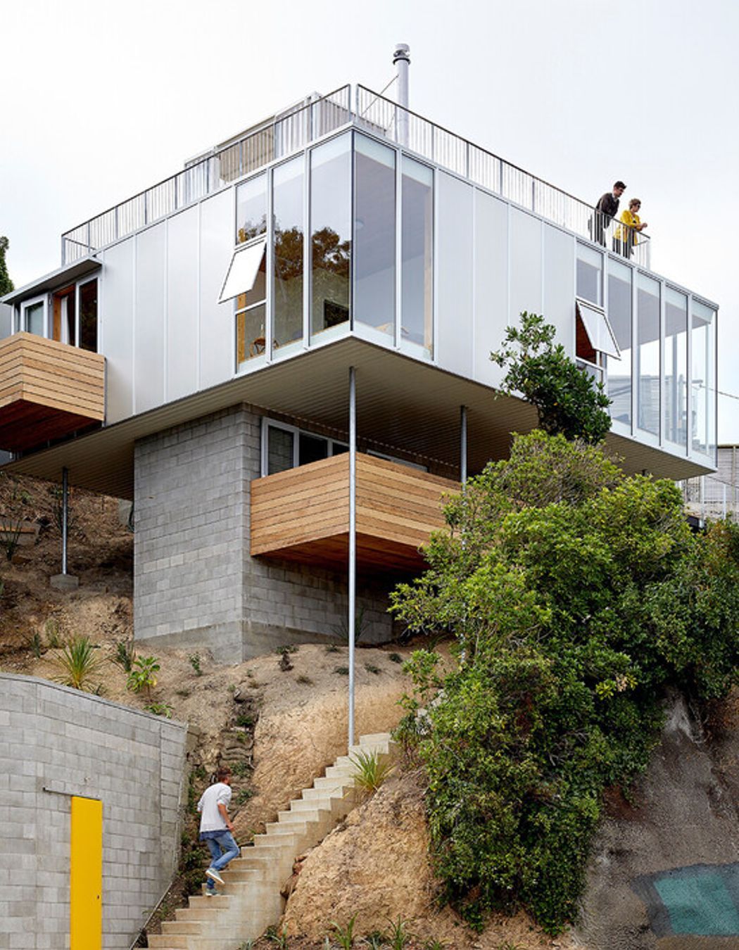 The rooftop peeks out over the surrounding trees.