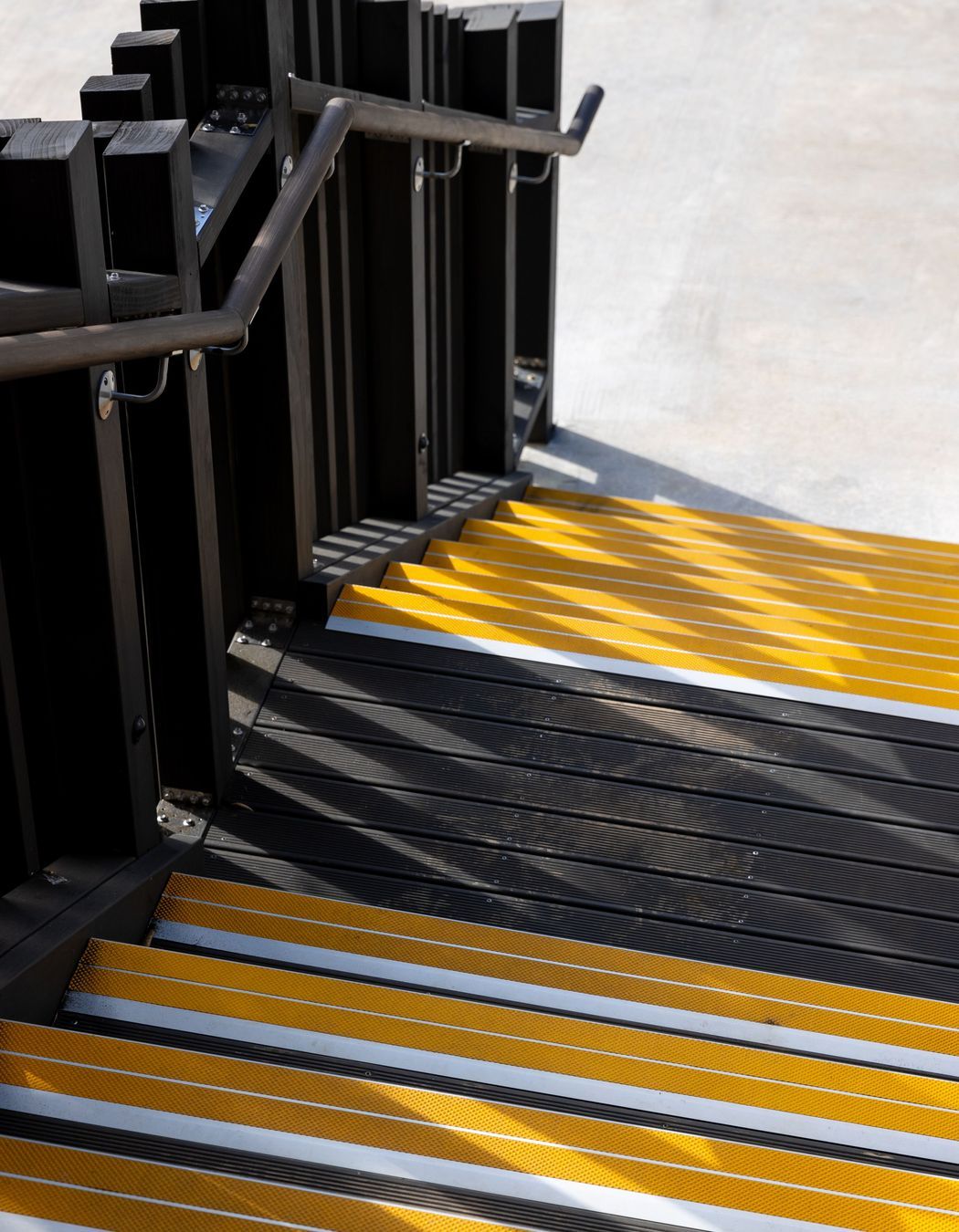 ©️ Jono Parker  The first floor is accessed by an exterior stairwell on either side.