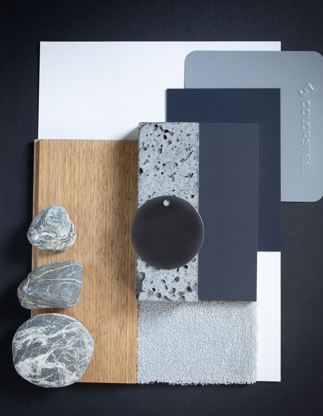 Colour: Sandstone Grey is a cool grey reminiscent of shadows on snow. In this palette they are offset against warm oak flooring, in a similar way to the evening sun warming the mountain ranges at the end of the day. The grains in natural stone, soft grey carpets, and clean blues create a cool fresh palette reflective of mountain regions and lakeside homes.