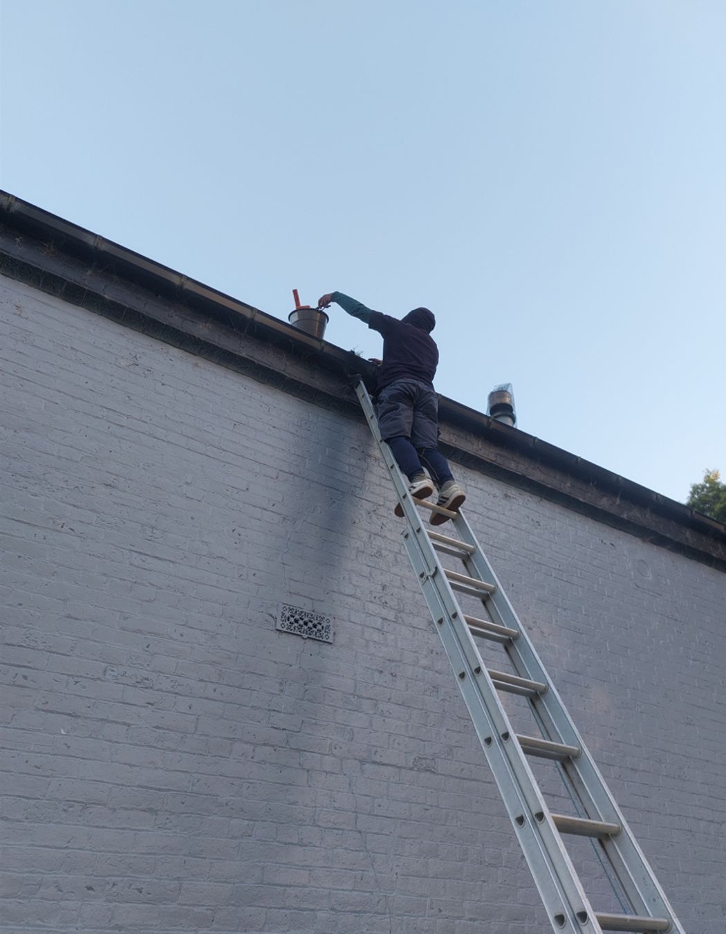 Taking out grass, leaves and any other rubbish caught in spouting