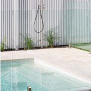 Cathedral crazy paving limestone pool surround with outdoor shower at modern barn house in Randwick, Sydney