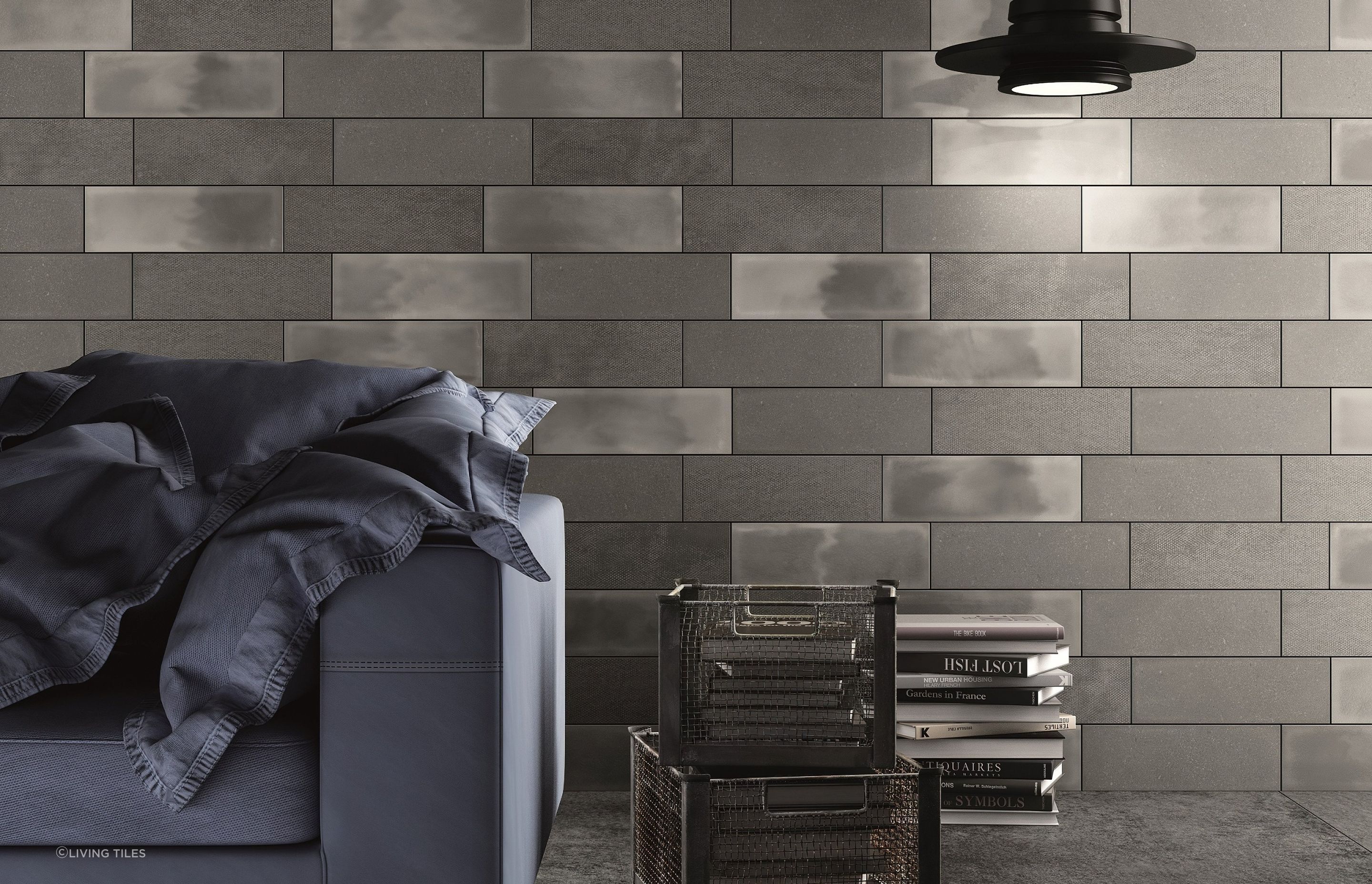 The grey Living Camp Wall tiles work well with this dark charcoal and light, creating a sophisticated industrial-looking interior.