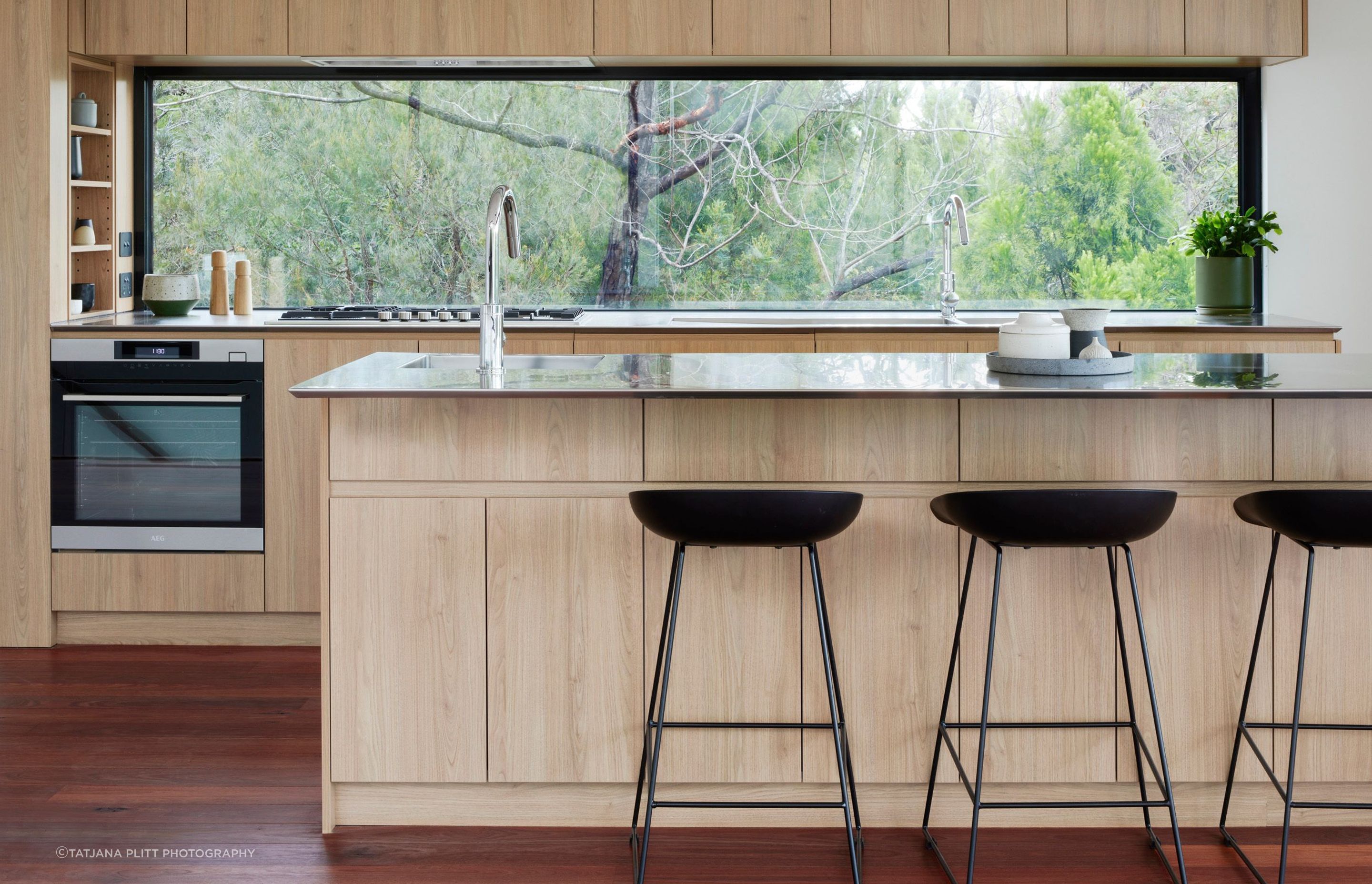 A window has been chosen as the kitchen splashback to maximise natural light and the beautiful view.
