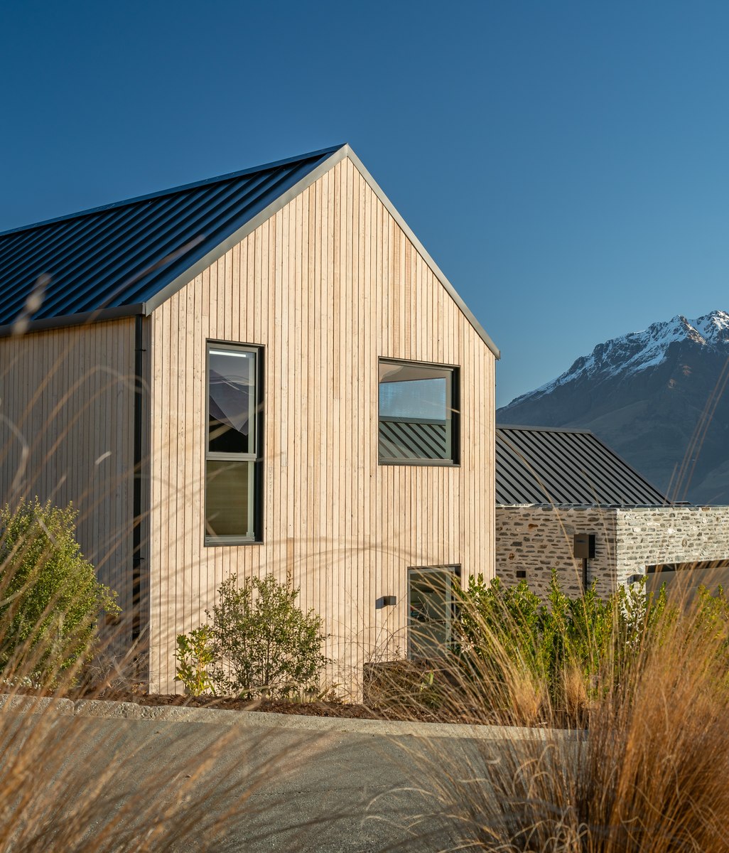 A gabled home framing mountain views in Queenstown