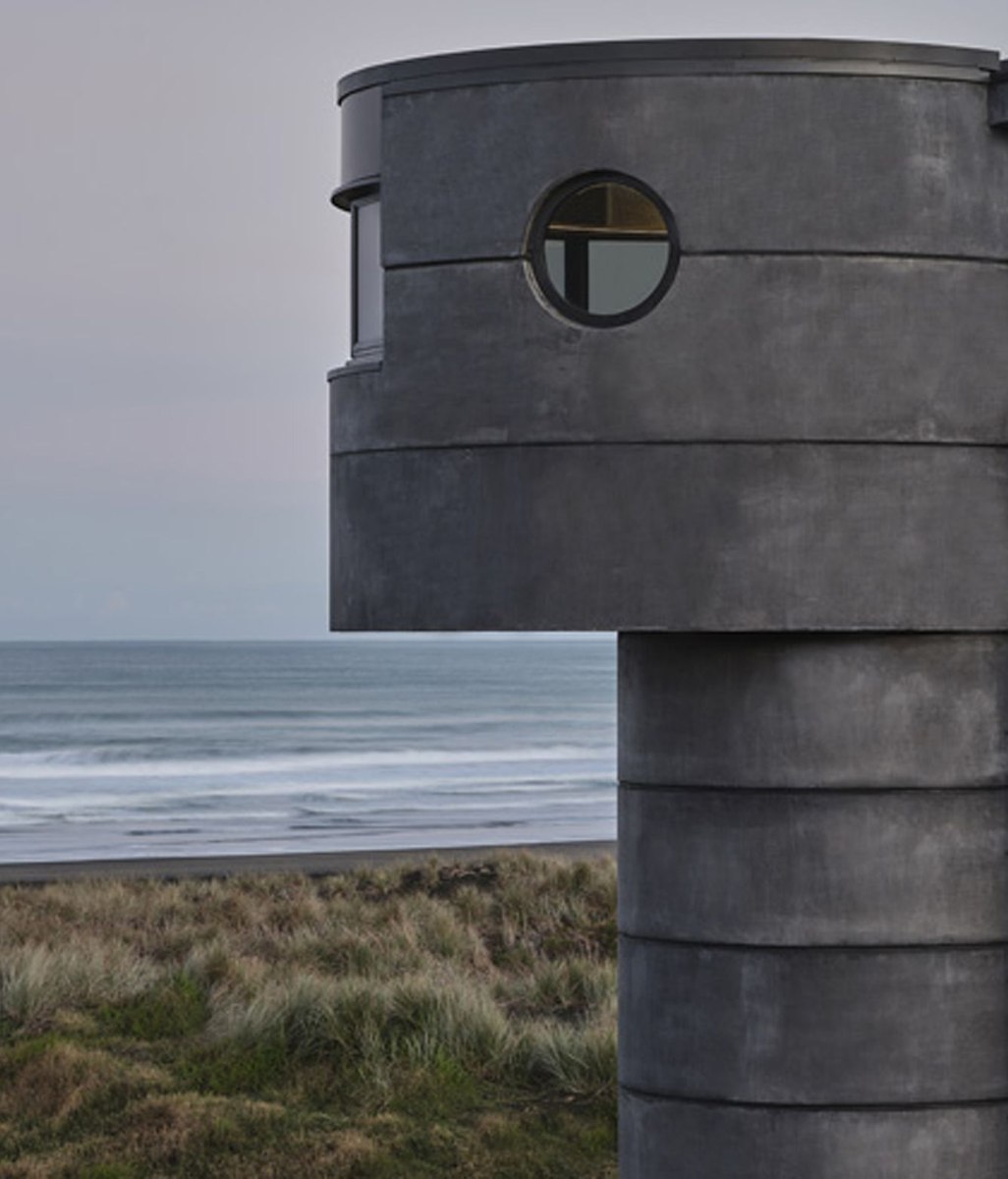Reflections of Aotearoa: PeterFell's darkest concrete oxide finds its match on North Piha Beach