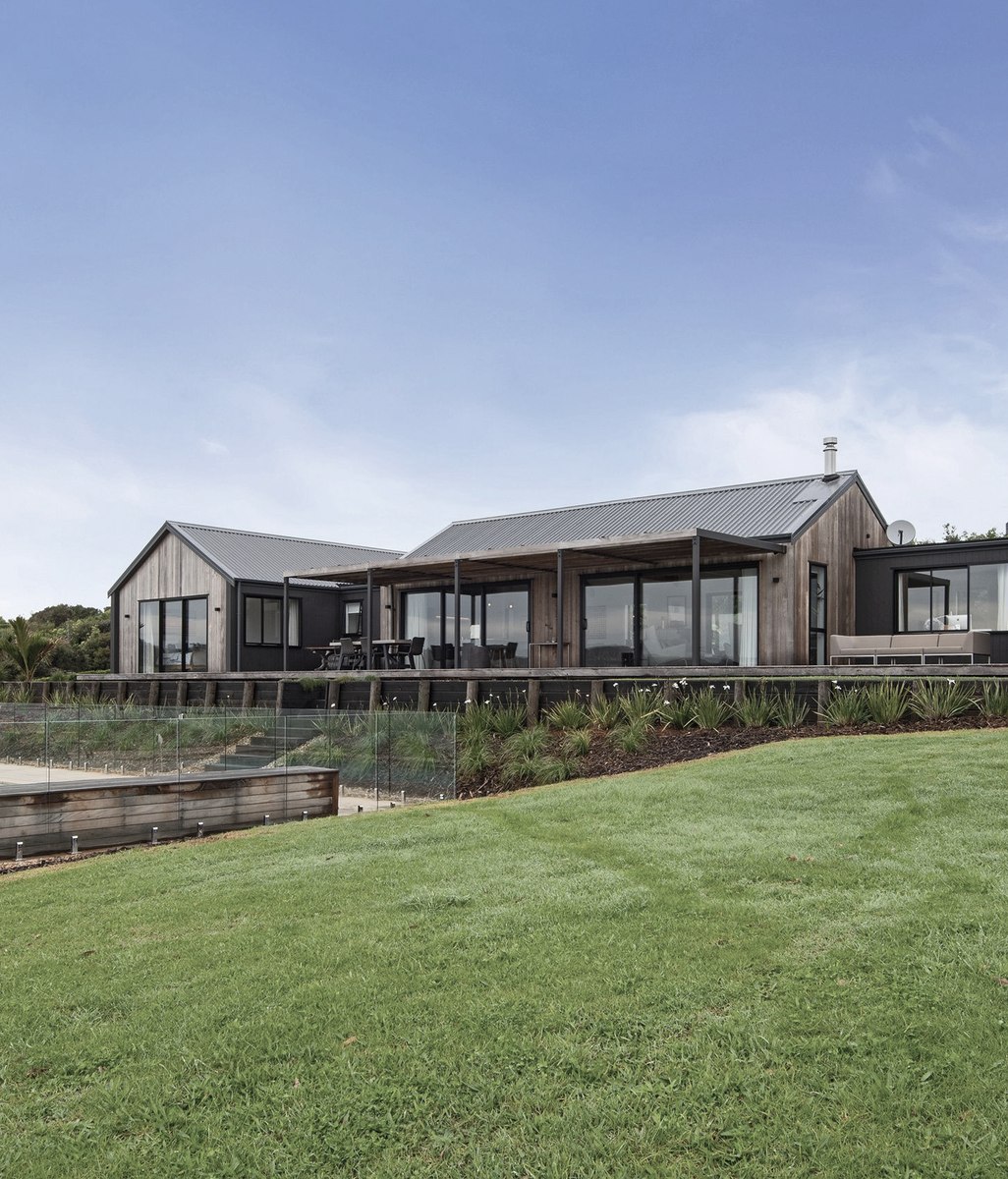 A gable-roofed dream home built on the shores of Northland’s Paewhenua Island