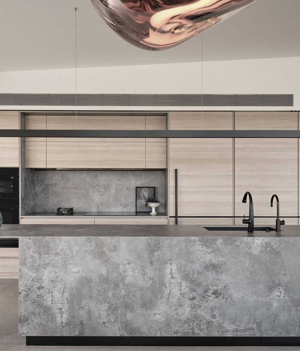 A sophisticated, streamlined kitchen with sweeping views