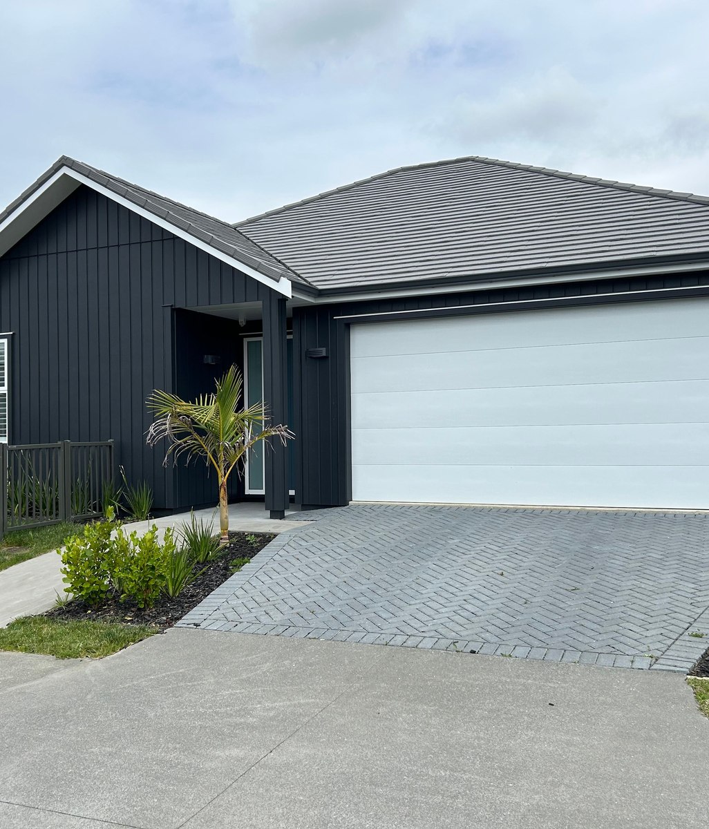 Can you install a garage door on a sloped driveway in Wellington?