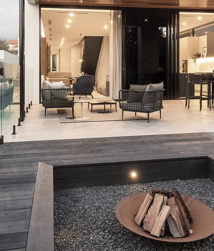 Backyard Fire pit featuring Burnt Cedar with lap pool