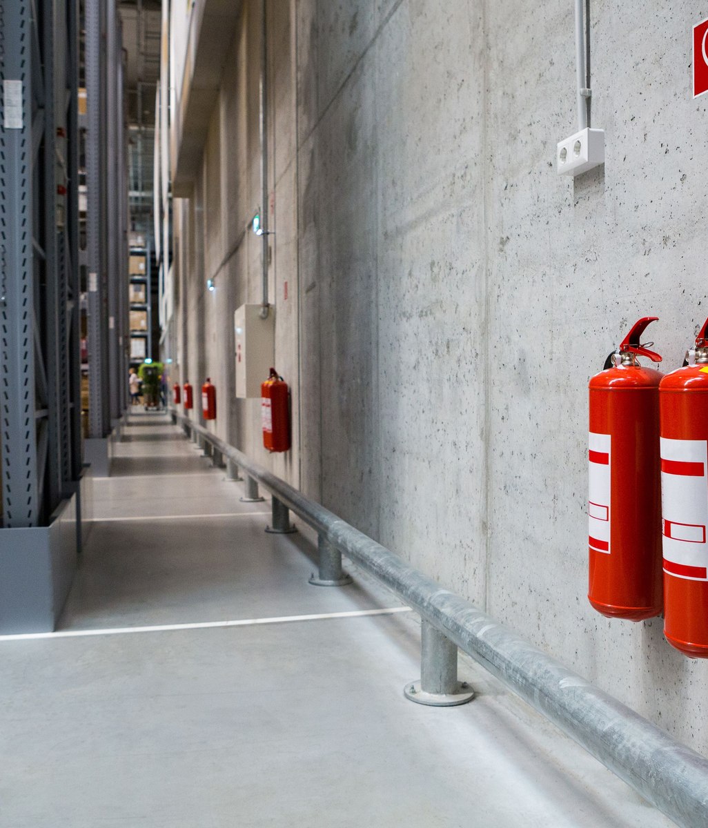 Which commercial buildings are mandated to have a Building Warrant of Fitness?