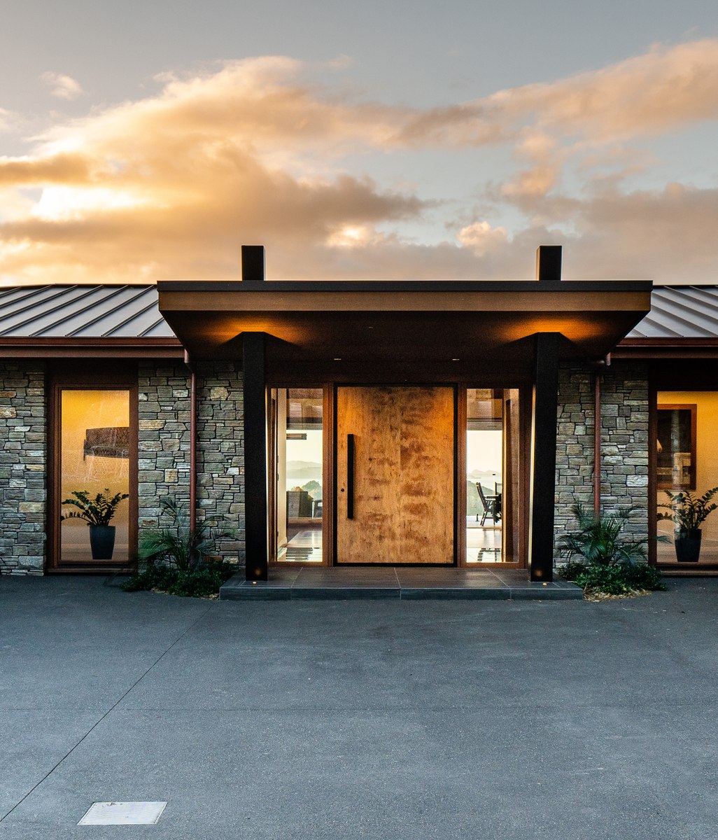 Refined industrial chic immersed in a Bay of Islands vista