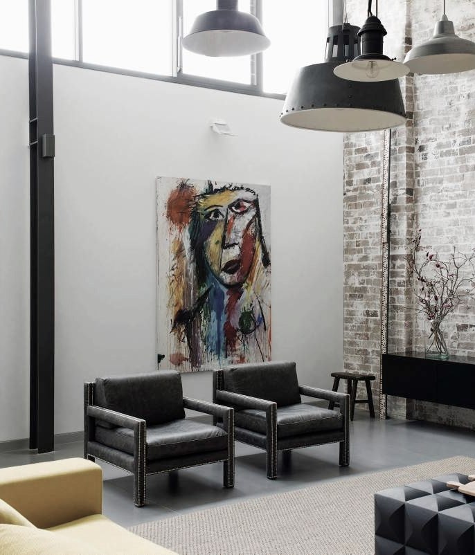 Raw materials and a refined palette transformed an industrial warehouse into a contemporary home