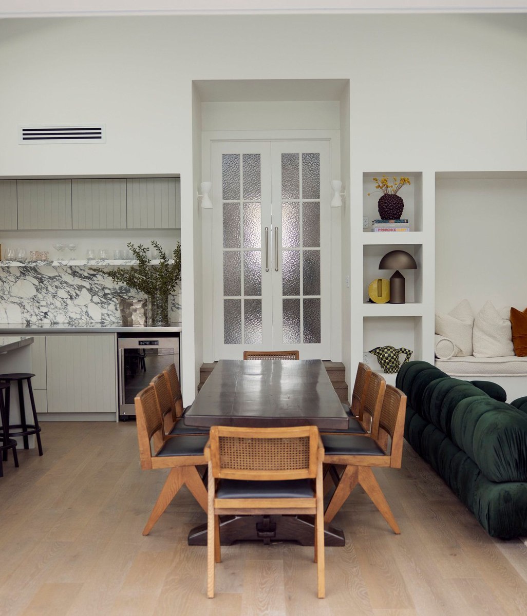 A collaboration between leading architecture and interior design practices, this elegant bungalow renovation creates space for a family to grow