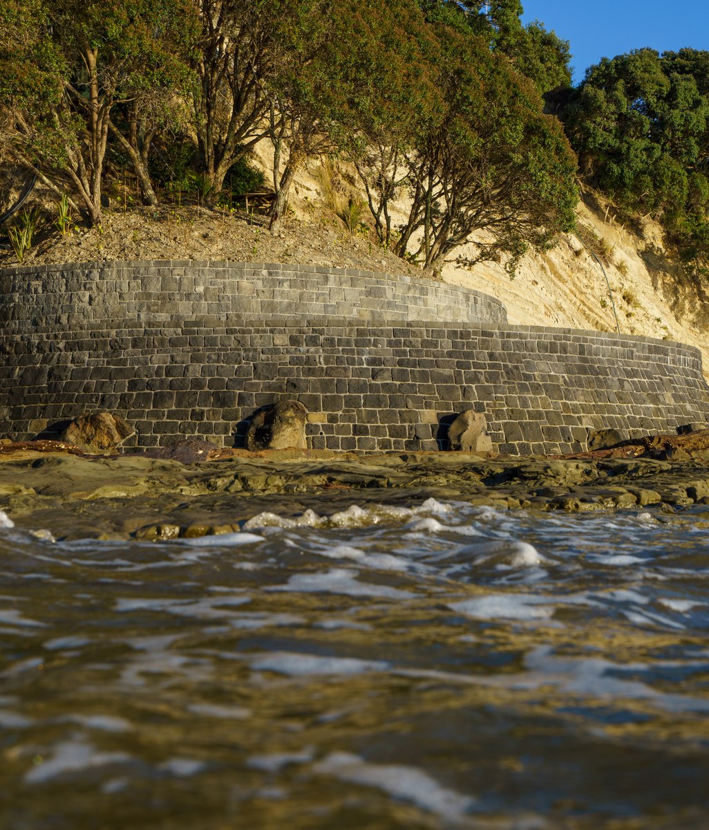 Auckland Stonemasons protect pohutukawa from the rising tide with expertly crafted sea wall