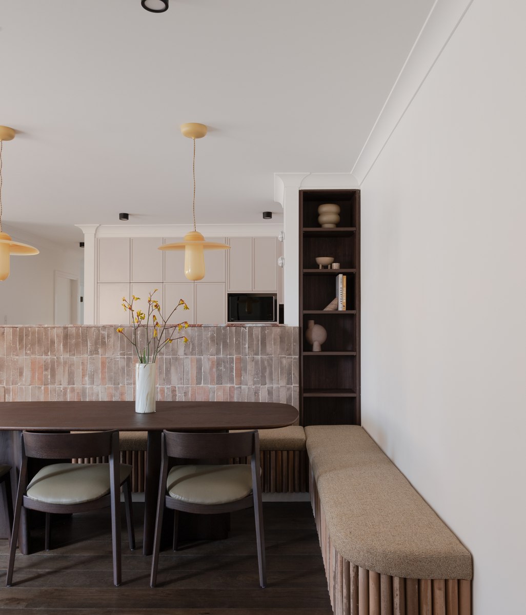 An unexpected material palette transforms this unassuming apartment into a beautifully bold design statement