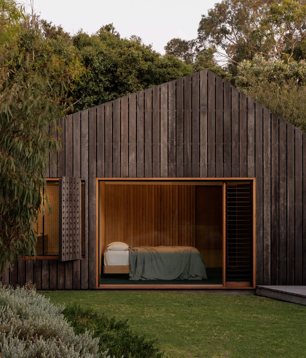 Clad in spotted gum, this rustic addition offers a serene and low-maintenance abode for two