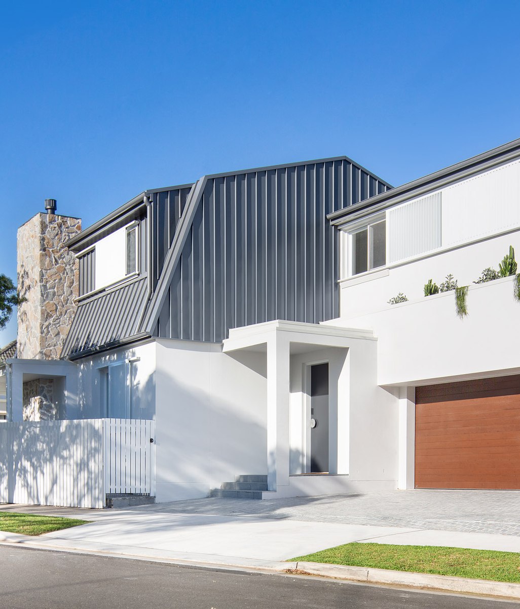 Barn House celebrates grounded, intentional architecture with natural stone material palette
