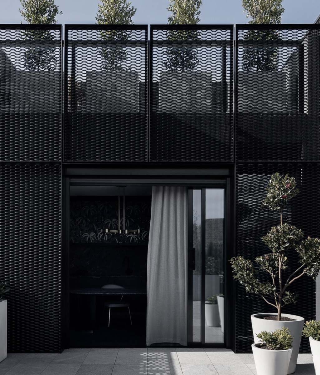 Two architectural typologies converge in this multifunctional office and home in Albert Park