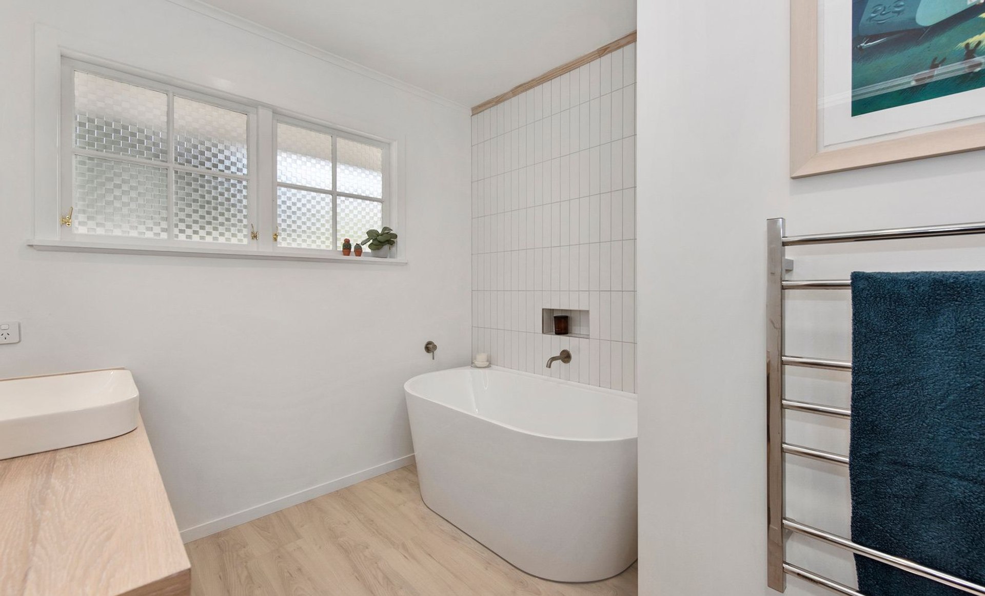 A Lovely Pair of Bathrooms and a Functional Laundry Unit